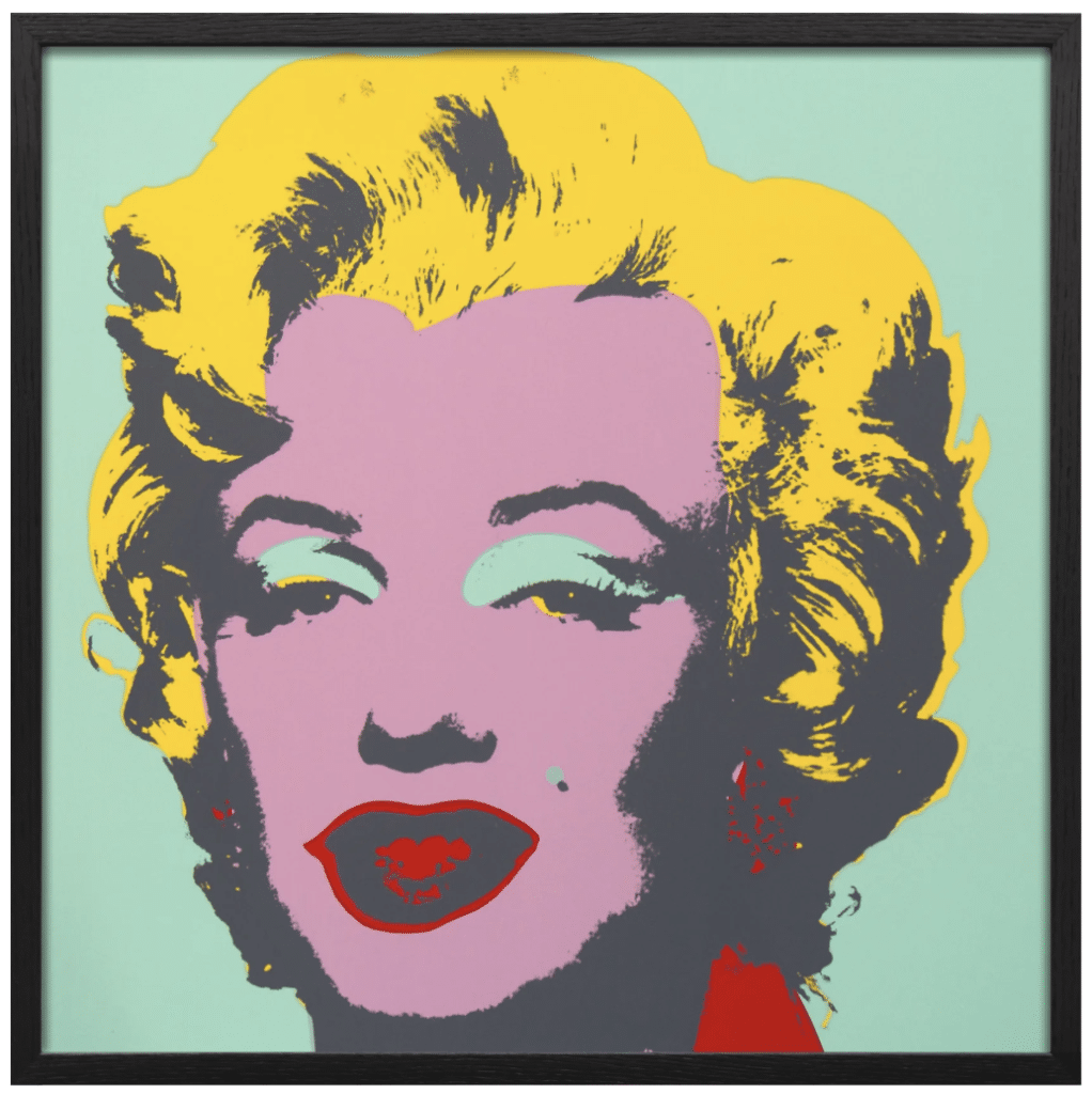 Pop-art portrait of Marilyn Monroe with yellow hair, pink face, mint eyeshadow, and red lips in a black frame.